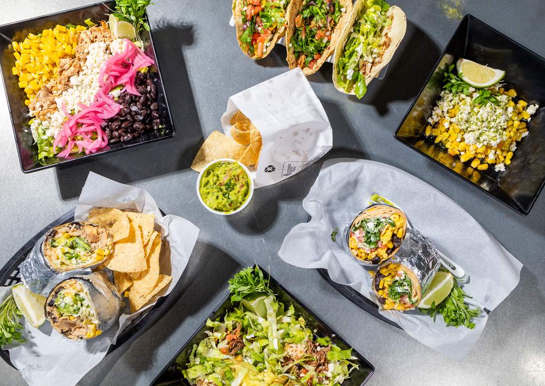 Delicious assortment of Avocado Pit Menu items Including Tacos, Bowls and Burritos